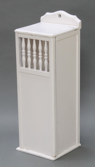 A white painted cabinet with hinged lid, the shelved interior enclosed by a grilled and panelled door 33"h x 11"w x 11 1/2"d 
