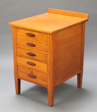 A honey oak filing chest fitted 5 long drawers, raised on square tapering supports 31"h x 20"w x 24 1/2" 