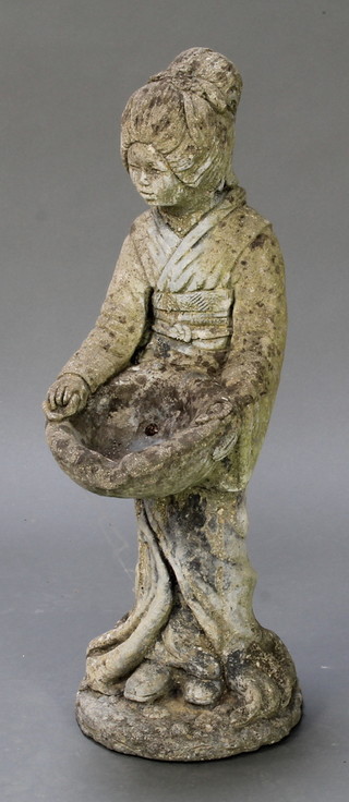 A concrete garden figure in the form of a Geisha girl holding a basket 25"h