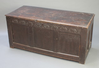 A 17th/18th Century oak coffer of panelled construction with plank top, having an iron lock, 23 1/2"h x 51"w x 22"d 