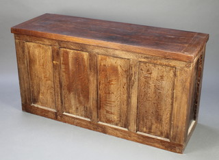 An elm coffer of panelled construction with hinged lid 53"w x 28"h x 18"d 