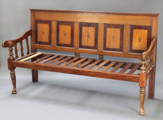 A 19th Century oak settle with panelled back and slatted seat raised on club supports 43"h x 73"w x 38"d 