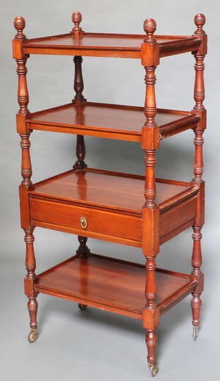 A Victorian rectangular mahogany 4 tier what-not, fitted a drawer raised on turned supports with casters 51"h x 24"w x 16"d 