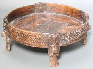 A circular carved Indian hardwood and metal mounted jardiniere, raised on panelled supports 12"h x 29" diam. 