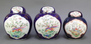A set of 3 Worcester style blue ground ginger jars and covers decorated with exotic birds 