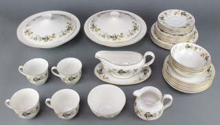 A Royal Doulton Larchmont pattern tea and dinner service comprising 4 tea cups, 4 saucers, 6 small plates, 4 medium plates, 6 soup bowls, 5 dessert bowls, a milk jug, sauce boat and stand, sugar bowl, 2 tureens and covers 