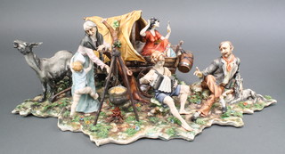 A large Capodimonte group of a gypsy encampment, indistinctly signed 10" 