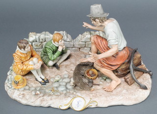 A Capodimonte group of a fisherman telling a tale to 2 young boys 15" 