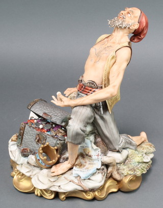 A Capodimonte figure of a pirate with a full treasure chest, signed Volta 11" 