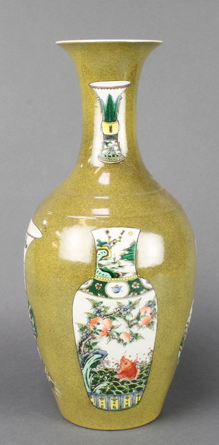 A Chinese 18th Century style green ground oviform vase decorated with vases 17" 