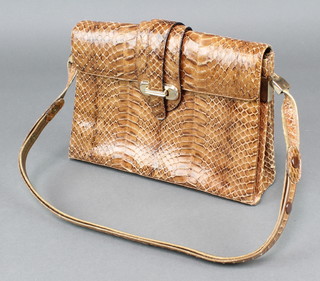 A lady's snakeskin  handbag with brown leather interior 7" x 10" x 3" 