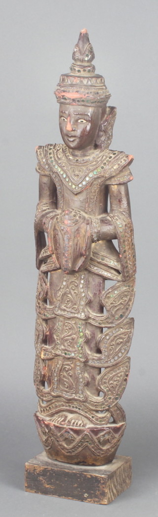 A carved and pierced Eastern figure of a standing Deity raised on a square base 25" x 5" x 3 1/2" 