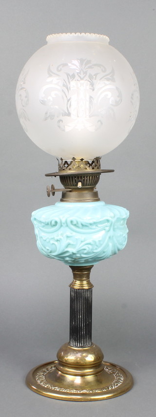 A Victorian opaque turquoise glass oil lamp with associated etched glass shade, raised on a brass foot converted to an electric table lamp with clear glass shade 