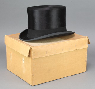 A gentleman's black top hat by Locks & Co size 7 1/8, complete with hat box 