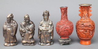 A club shaped cinnabar lacquer vase decorated figures 5", a twin handled ditto 7" and 3 bronze figures of deities 5"   