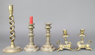 A pair of brass candlesticks decorated mythical beasts with sconces 6", a 19th Century brass spiral turned candlestick 12" and a pair of 19th Century candlesticks 7" (drilled for table lamps) 