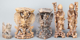 A pair of Chinese carved root wood figures of Sages set hardstone eyes (1 eye is missing, there is damage to a staff and drilled for table lamps ) 14", a pair of carved Japanese figures of winged mythical beasts  13" (damage to carving on 1) together with a carved hardwood figure of a mythical beast 7" (chipped)