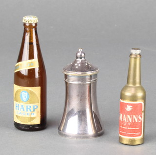 A Manns novelty bottle opener in the form of a bottle 2 1/2", a miniature bottle of Harp lager 3" and a waisted silver pepper pot 