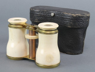 A pair of 19th Century gilt metal and bone mounted opera glasses with leather carrying case 