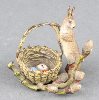 An Edwardian Austrian cold painted bronze figure of a standing rabbit with basket of eggs 1 1/2" 