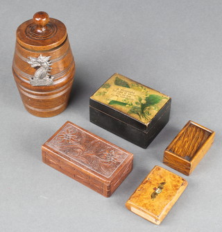 A miniature turned wooden barrel 5" with armorial decoration, a rectangular carved wooden stamp box, a walnut snuff box the lid decorated RAF crest (section of timber missing) and 2 other boxes 
