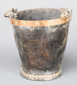 A 19th Century leather and copper cavalry feed bucket, the base marked DI and with crows foot mark 10"h x 9" diam.