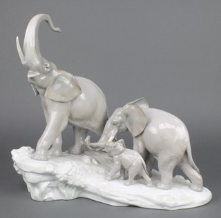 A Lladro group of 3 elephants on a rocky outcrop 16"