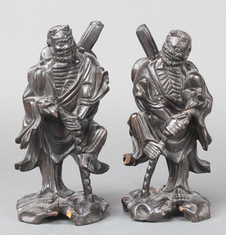 A pair of Japanese carved hardwood figures of standing warriors 7"