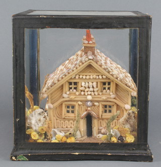 A Victorian shell model of a house contained in a glazed case 9" x 9" x 9 1/2" 