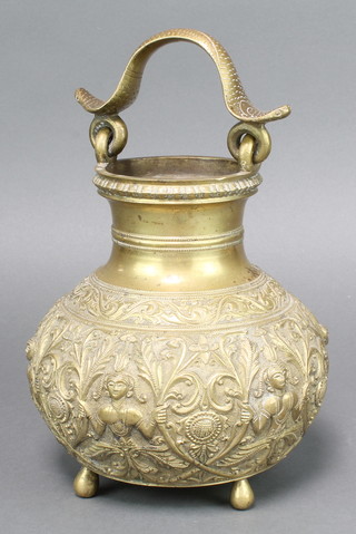 An Eastern gilt metal circular pale with cobra handle, the body cast figures raised on 4 bun feet 8" 