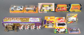 A crescent 1977 model of The State Coach, 2 Politis model racing cars boxed, a Corgi Hesketh 308 F1 no.160 model racing car, ditto high speed mini coach no.701 and ditto Mustang Mk 1 no.392 boxed and 5 other boxed model vehicles 