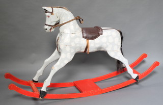 A dapple grey wooden painted rocking horse 37"h x 68"l x 13"w 