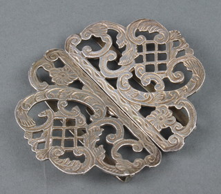 A silver buckle with pierced and chased decoration, rubbed marks 48 grams