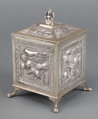 An Indian repousse silver square tea caddy decorated with animals, on paw feet, 6", 322 grams 