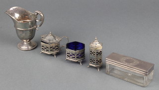 A Victorian silver mounted toilet jar London 1862, a 3 piece silver condiment and a cream jug 154 grams 