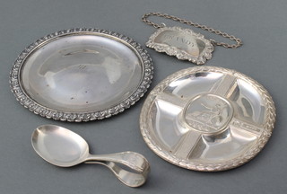 A contemporary silver dish and 1 other, a spirit label, a child's spoon 176 grams 