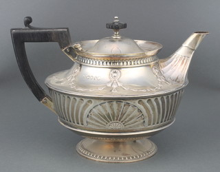 A Victorian repousse silver teapot with Adam style decoration and ebony mounts London 1888, maker William Hutton & Sons, gross 560 grams 