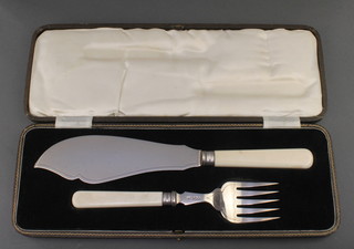 A pair of silver and ivory fish servers Sheffield 1935, cased 