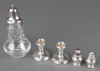A pair of dwarf silver candlesticks Birmingham 1988 2", a pair of condiments and a plated mounted  shaker 