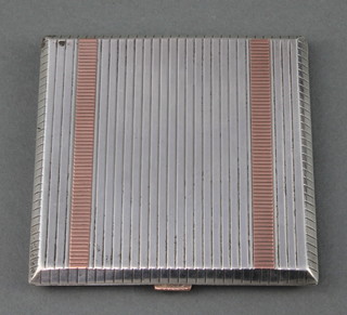 A stylish silver gold mounted ribbed compact Birmingham 1950 Maker HK 164 grams gross