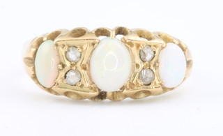 A 14ct opal and diamond ring size  N 1/2
