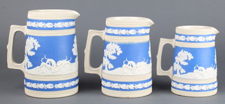 A set of 3 Victorian Copeland 2 colour moulded jugs with fox hunting scenes 