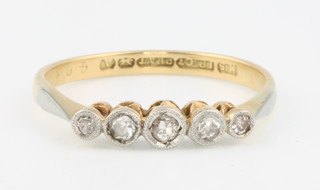 An 18ct yellow gold 5 stone diamond ring size N 