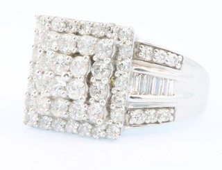 A 14ct yellow gold dress ring set with brilliant and baguette cut diamonds approx 2.7ct, size P 