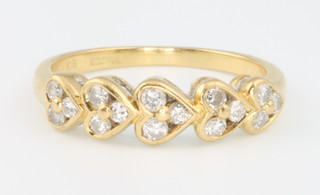 An 18ct yellow gold diamond set heart shaped ring size  N 1/2