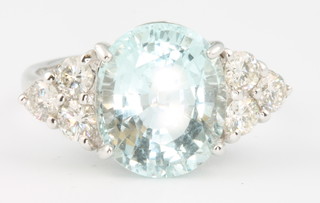 An 18ct white gold oval aquamarine and diamond ring, the centre stone approx. 4.4ct the diamonds 0.93ct size O 