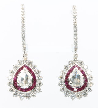 A pair of 18ct white gold pear shaped ruby and diamond earrings the centre stones approx. 0.68ct surrounded by diamonds approx. 1.48ct and rubies approx 1.55ct 