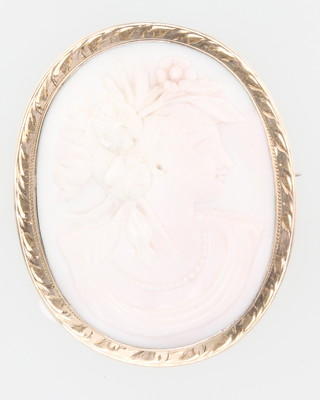 A 9ct yellow gold carved cameo brooch in the form of a classical lady 