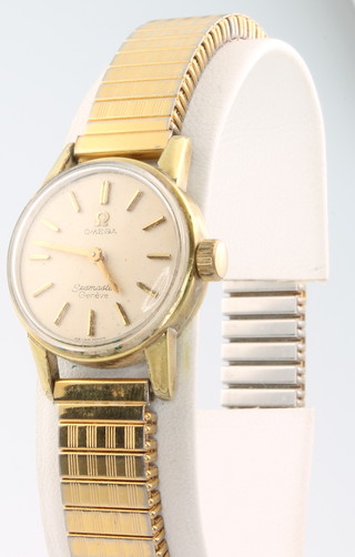 A lady's gilt cased Omega Seamaster wristwatch on an expanding bracelet 