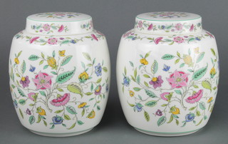 A pair of Minton Haddon Hall ginger jars and covers decorated with flowers 7" 